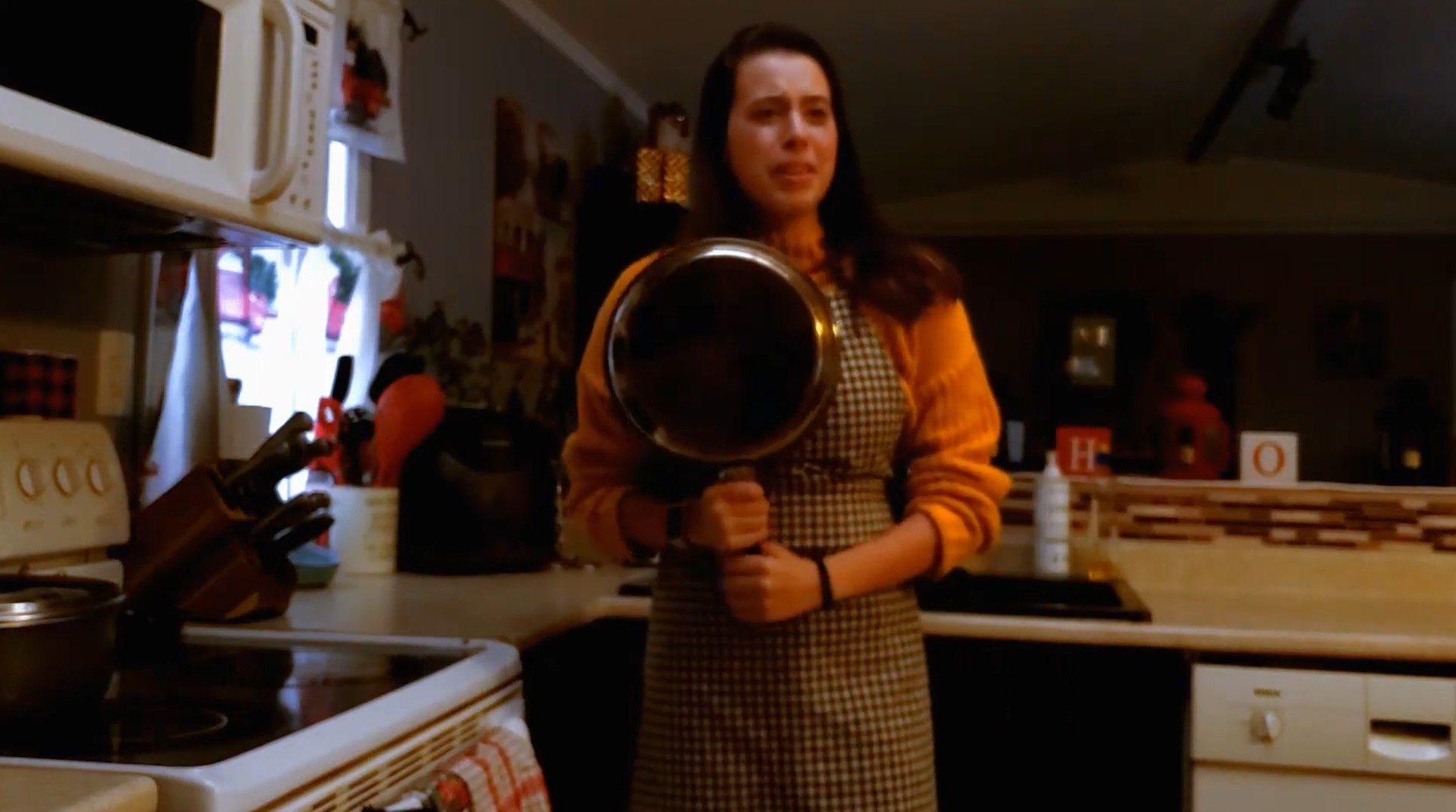 Photo of Jen holding a frying pan.